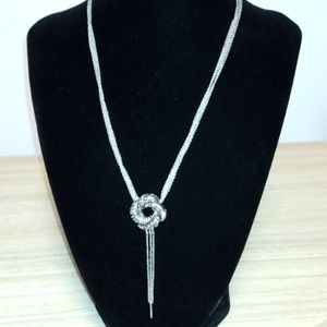Textured silvertone pendant with tassel on 5 silvertone chains